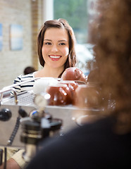 Image showing Customer Looking At Waitress In Cafeteria