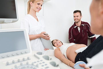 Image showing Doctor Showing Digital Tablet To Expectant Couple