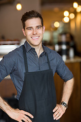 Image showing Happy Male Owner Standing In Cafe