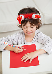 Image showing Boy Making Christmas Greeting Card