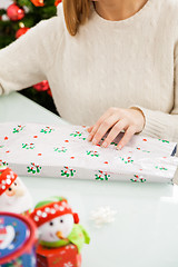 Image showing Woman Packing Christmas Present