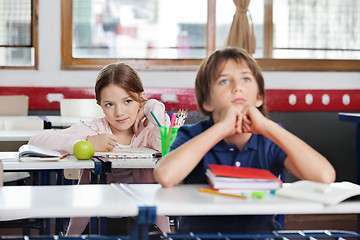 Image showing Schoolgirl Looking At Schoolboy