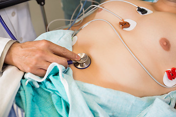 Image showing Doctor With Stethoscope Examining Patient