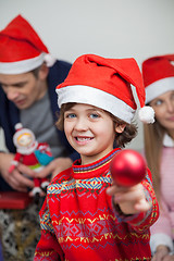 Image showing Boy Showing Christmas Decoration At Home