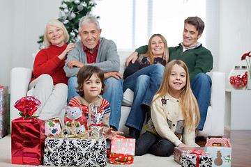 Image showing Family With Christmas Gifts In House