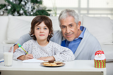 Image showing Grandfather And Son With Envelope