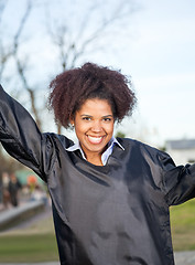 Image showing Happy Woman In Graduation Gown On Campus