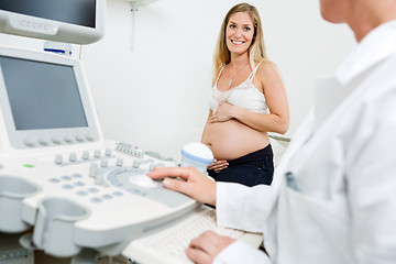 Image showing Pregnant Woman Looking At Obstetrician