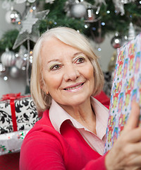 Image showing Smiling Woman With Christmas Gift