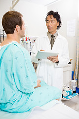 Image showing Doctor Discussing Report Over Digital Tablet With Patient