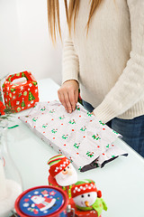 Image showing Woman Packing Christmas Gifts