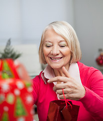 Image showing Senior Woman With Christmas Gift