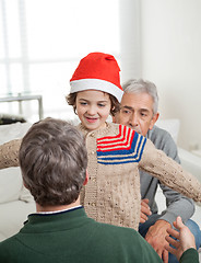 Image showing Son In Santa Hat About To Embrace Father