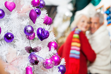 Image showing Decorated Christmas Tree And Couple In Store