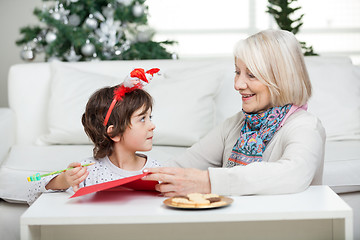 Image showing Grandmother Assisting Boy In Writing Letter To Santa Claus