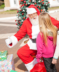 Image showing Santa Claus Gesturing While Looking At Girl