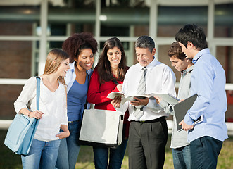 Image showing Teacher Explaining Lesson To Students On College Campus