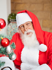 Image showing Man Dressed As Santa Claus Outside House