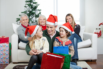 Image showing Multigeneration Family With Christmas Presents