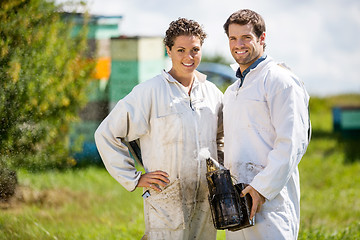 Image showing Beekeepers With Smoker Standing At Apiary