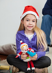 Image showing Girl In Santa Hat Holding Toy