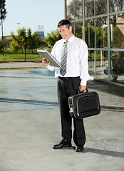 Image showing Male Professor Reading Book At University Campus