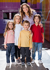 Image showing Cute Little Children With Teacher In Kindergarten