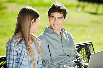 Image showing Students With Laptop Looking At Each Other In Campus