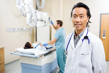 Image showing Radiologist With Nurse Preparing Patient For Xray