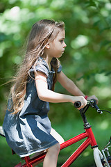 Image showing Little girl riding bicycle