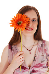 Image showing Girl holding flower.