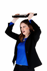 Image showing Woman throwing laptop.