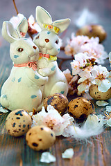 Image showing Easter bunnies and apricot flowering branches.