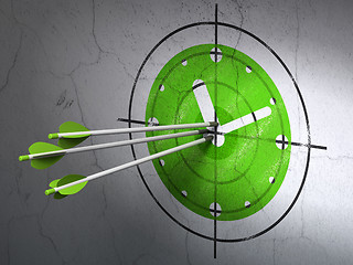 Image showing Time concept: arrows in Clock target on wall background
