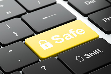 Image showing Safety concept: Closed Padlock and Safe on computer keyboard background