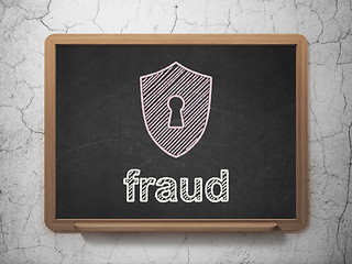 Image showing Protection concept: Shield With Keyhole and Fraud on chalkboard background