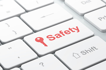 Image showing Protection concept: Key and Safety on computer keyboard background