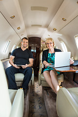 Image showing Confident Business People In Corporate Jet