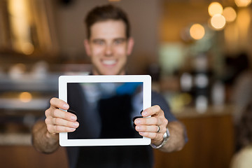 Image showing Cafe Owner Showing Digital Tablet
