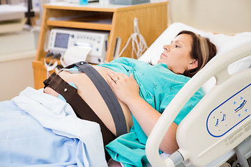 Image showing Birthing Woman with Electronic Fetal Monitor Attached