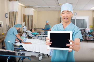 Image showing Male Nurse Showing Digital Tablet In Hospital Ward