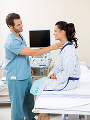 Image showing Nurse Examining Patient's Neck Before Ultrasound Test