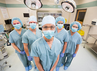 Image showing Medical Team In Scrubs Standing Inside Operation Room