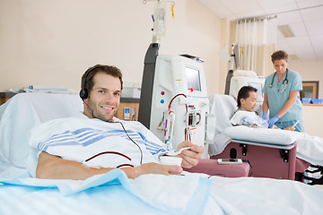 Image showing Patient Holding Glass Of Crushed Ice During Renal Dialysis