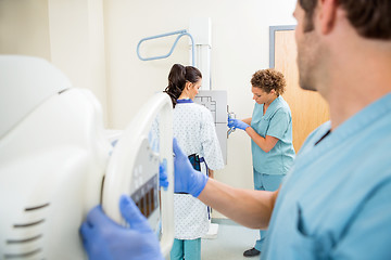 Image showing Nurses Adjusting Chest Xray Machines For Patient