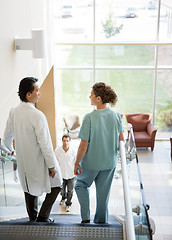Image showing Medical Team And Patient Walking On Stairs
