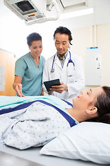 Image showing Medical Team Using Digital Tablet In Examination Room