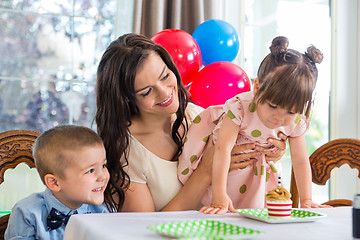 Image showing Family Celebrating Girl's Birthday