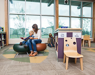 Image showing Student With Teacher Reading Book In Library