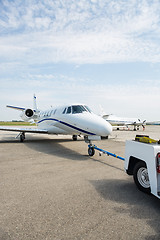 Image showing Private Jet Being Towed